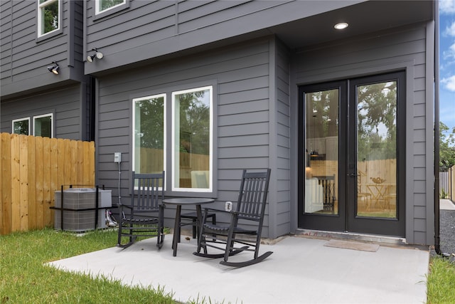 property entrance featuring a patio and central AC