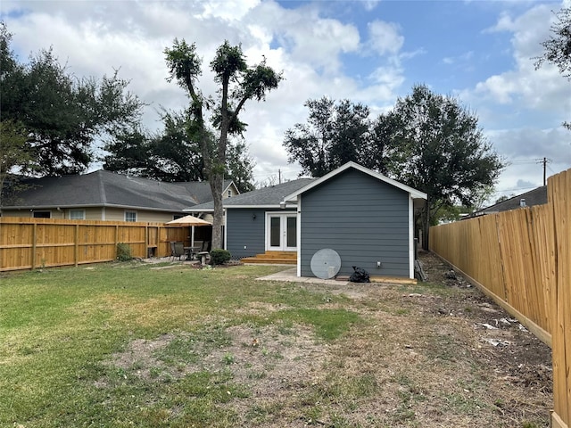 6811 Roswell St, Houston, TX 77022 - back of house featuring french doors, a patio area, and entry steps