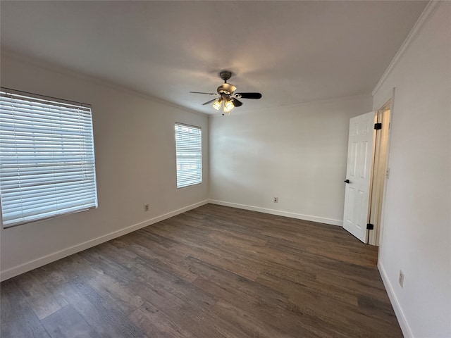 spare room featuring crown molding, ceiling fan, and dark hardwood / wood-style floors