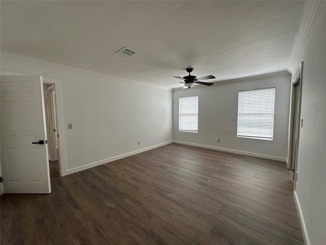 empty room featuring dark hardwood / wood-style floors, ceiling fan, and ornamental molding