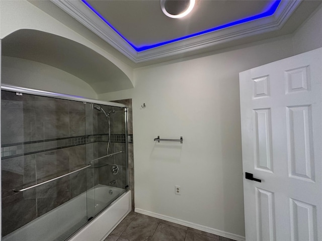 6811 Roswell St, Houston, TX 77022 - bathroom with a tray ceiling, combined bath / shower with glass door, baseboards, ornamental molding, and tile patterned flooring