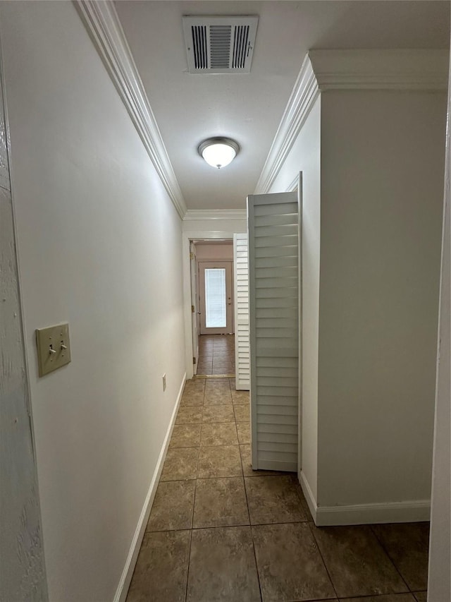 6811 Roswell St, Houston, TX 77022 - corridor featuring ornamental molding, baseboards, and tile patterned floors