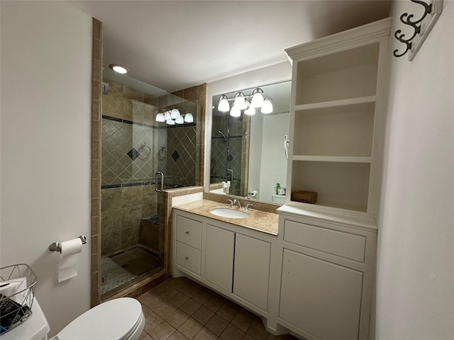6811 Roswell St, Houston, TX 77022 - bathroom featuring tile patterned floors, a stall shower, toilet, and vanity