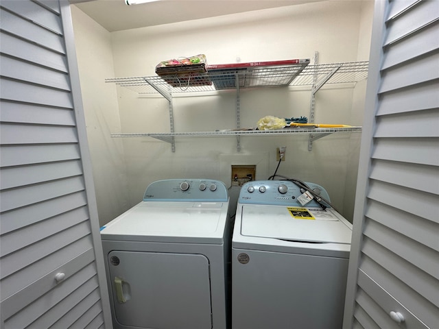 laundry room featuring washing machine and clothes dryer