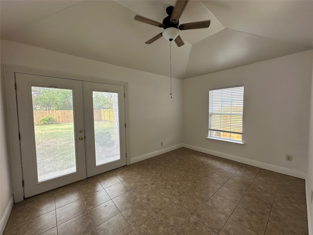 tiled spare room with french doors, vaulted ceiling, plenty of natural light, and ceiling fan