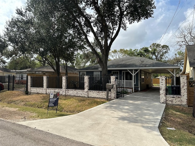 6811 Roswell St, Houston, TX 77022 - ranch-style home featuring driveway, a fenced front yard, and a carport