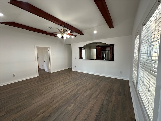 unfurnished living room with dark hardwood / wood-style floors, beam ceiling, and ceiling fan