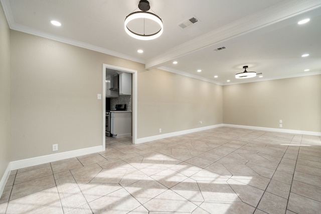 tiled spare room with crown molding