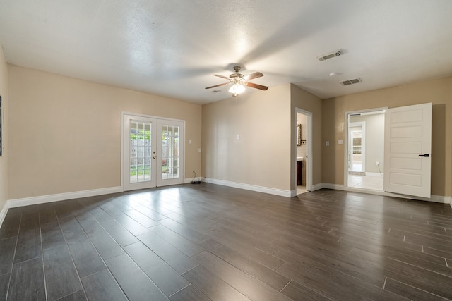 spare room featuring a textured ceiling, ceiling fan, french doors, and dark hardwood / wood-style floors