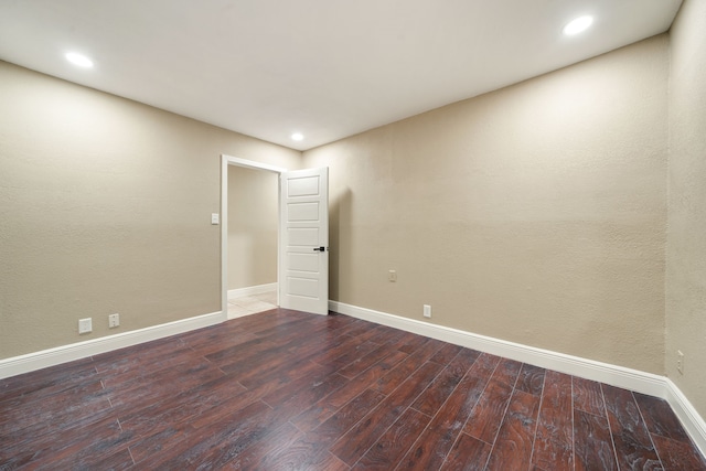 spare room featuring wood-type flooring