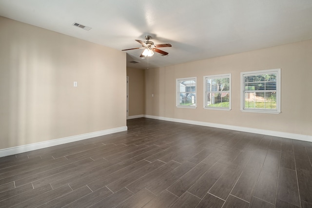 unfurnished room featuring dark hardwood / wood-style floors, a healthy amount of sunlight, and ceiling fan