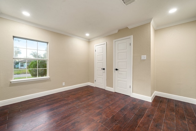 unfurnished bedroom featuring dark hardwood / wood-style floors and ornamental molding