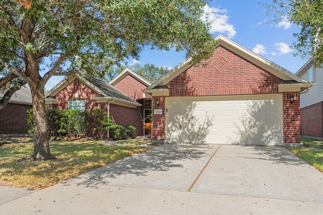 front facade with a front yard and a garage