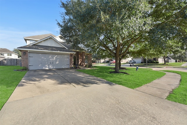 view of front of house featuring a front yard and a garage