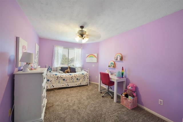 carpeted bedroom featuring a textured ceiling and ceiling fan