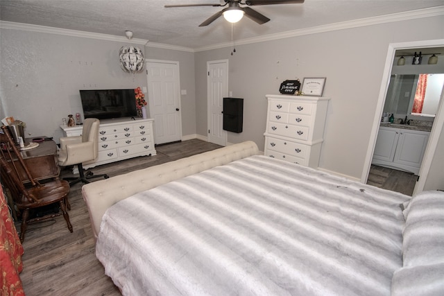 bedroom featuring ensuite bath, ceiling fan, sink, hardwood / wood-style floors, and ornamental molding