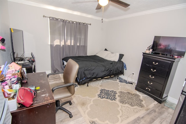 bedroom with light wood-type flooring, ceiling fan, and ornamental molding