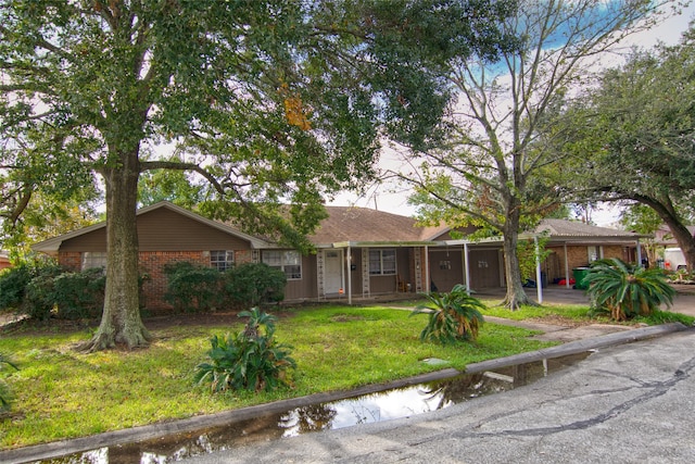 ranch-style house with a front yard