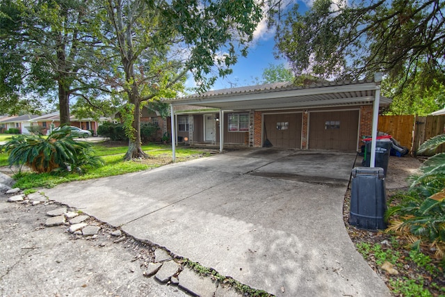 ranch-style house featuring a front yard and a garage