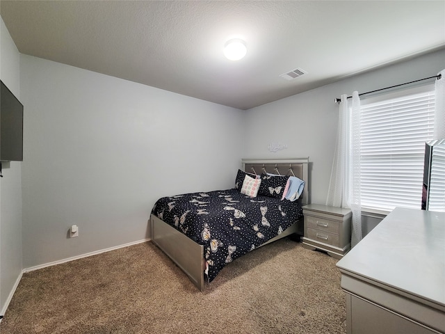 bedroom featuring carpet and multiple windows