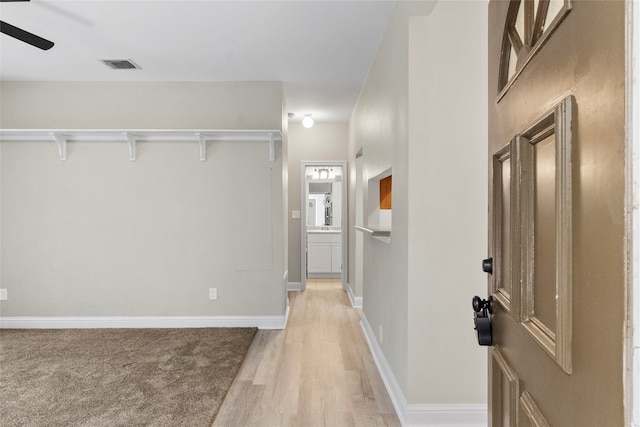 corridor featuring light hardwood / wood-style floors