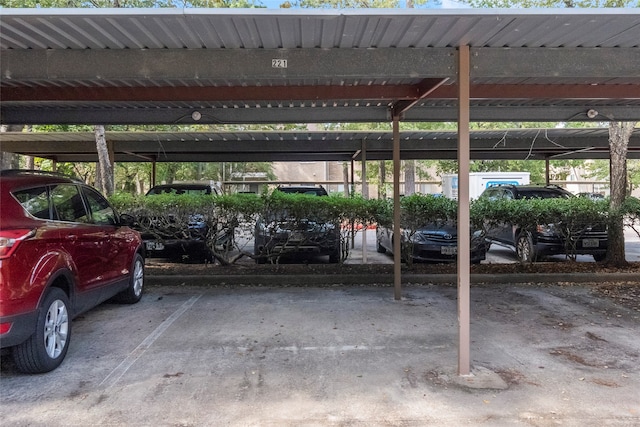 view of vehicle parking with a carport