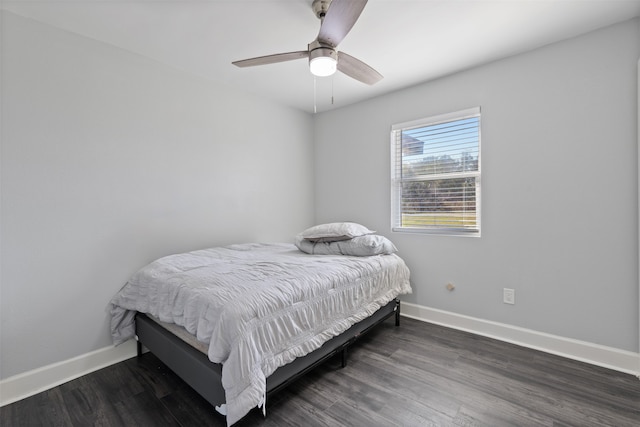 bedroom featuring dark hardwood / wood-style floors and ceiling fan