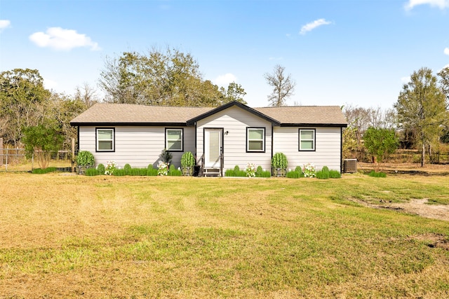 single story home featuring a front yard