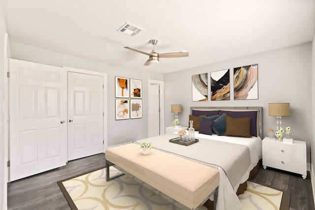 bedroom with ceiling fan, dark wood-type flooring, and a closet