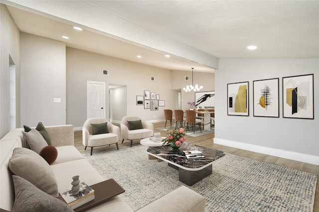 living room with light hardwood / wood-style floors, lofted ceiling, and a chandelier