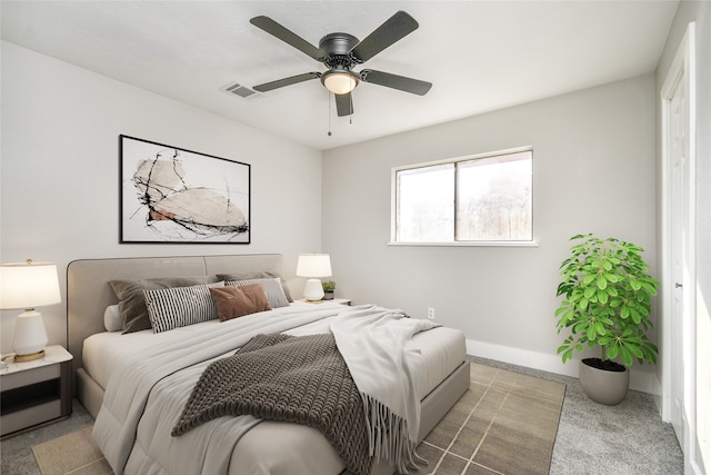 bedroom featuring ceiling fan and light carpet