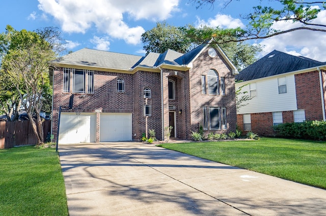 view of front of home featuring a front yard and a garage