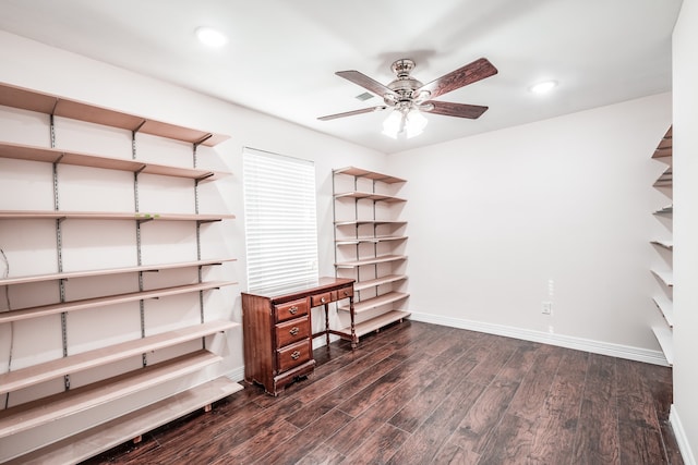 unfurnished office featuring dark hardwood / wood-style flooring and ceiling fan