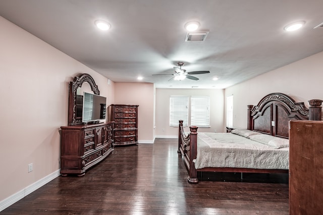 bedroom with dark hardwood / wood-style flooring and ceiling fan