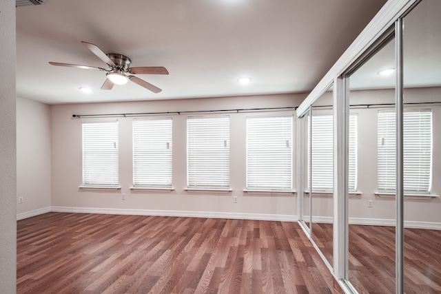 unfurnished sunroom with plenty of natural light and ceiling fan