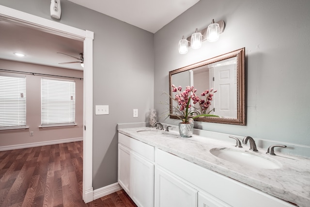 bathroom with ceiling fan, wood-type flooring, and vanity