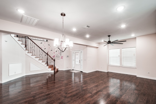 interior space with ceiling fan with notable chandelier and dark hardwood / wood-style floors