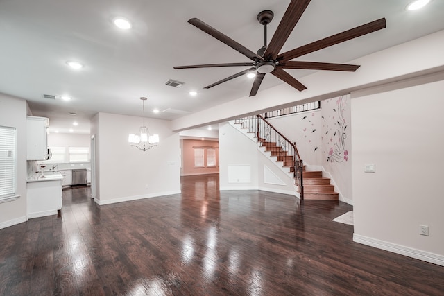 unfurnished living room featuring dark hardwood / wood-style floors and ceiling fan with notable chandelier