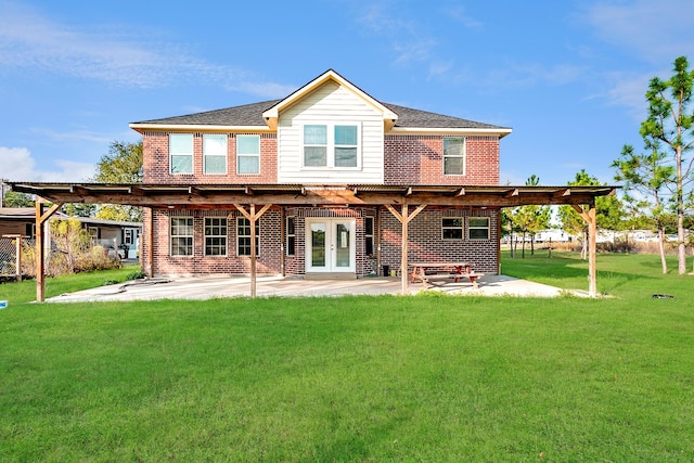 rear view of house with a patio area, french doors, and a lawn