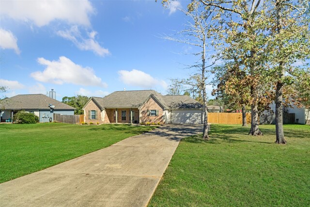 view of front of house with a garage and a front lawn