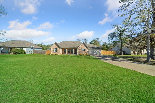 ranch-style home featuring a front yard