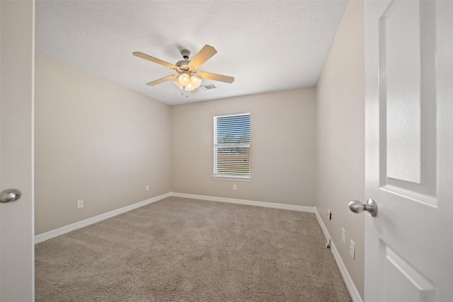 unfurnished room with ceiling fan and light colored carpet