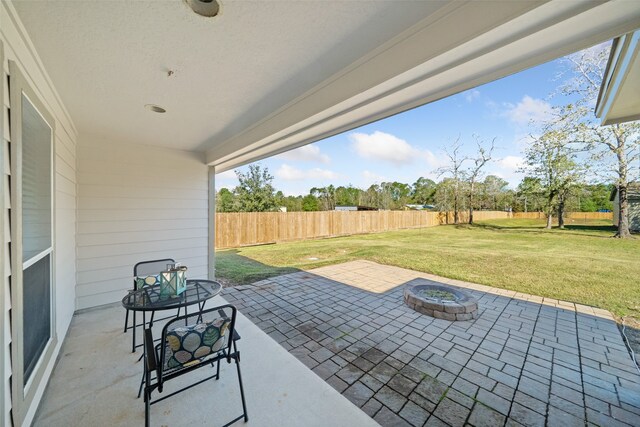 view of patio featuring an outdoor fire pit