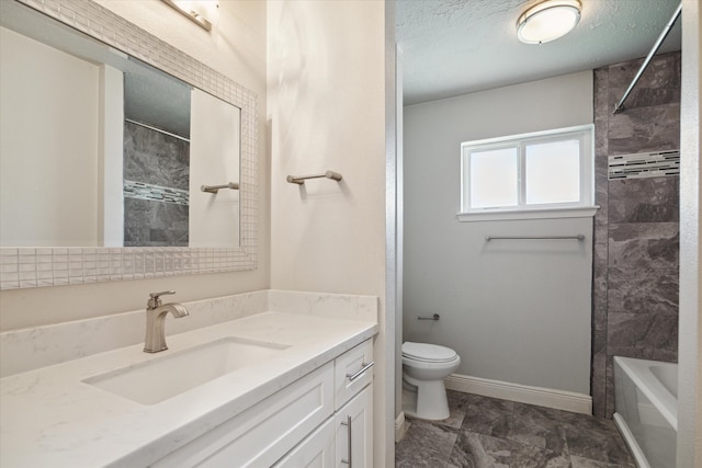 full bathroom featuring vanity, toilet, a textured ceiling, and tiled shower / bath