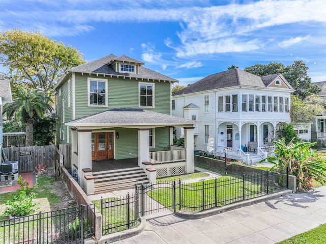 view of front of home with central AC unit and covered porch