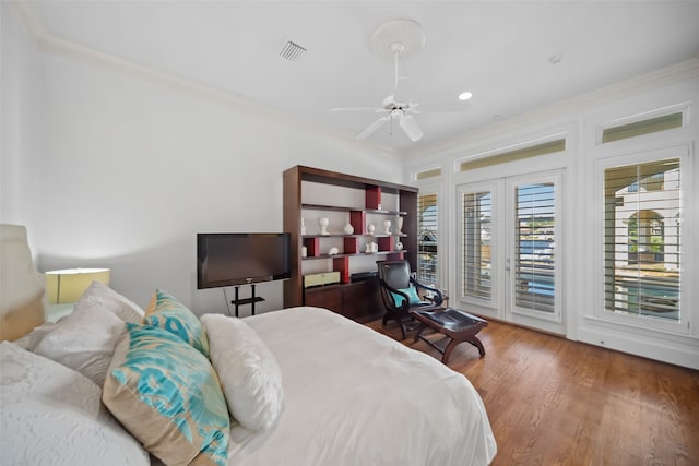 bedroom with hardwood / wood-style flooring, ceiling fan, access to exterior, and ornamental molding