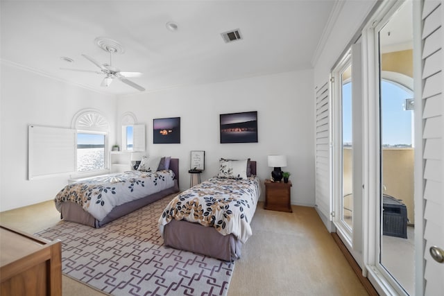 carpeted bedroom featuring ceiling fan, access to exterior, and crown molding