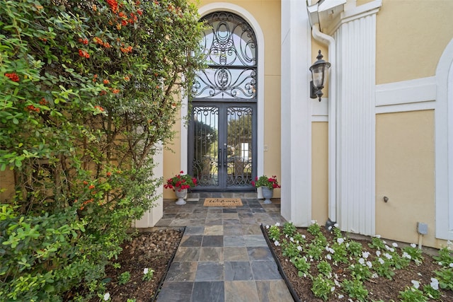 view of exterior entry featuring french doors