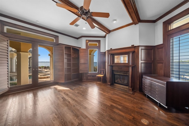 unfurnished living room featuring vaulted ceiling with beams, ceiling fan, dark hardwood / wood-style flooring, and crown molding