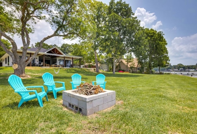 view of yard featuring an outdoor fire pit